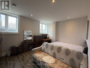 Markham (Grandview) apartment for rent - A bedroom with a bed, desk, and chair.