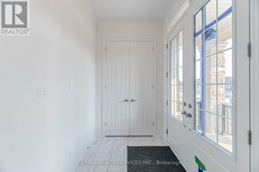 Adjala-Tosorontio (Colgan) apartment for rent - A white door with a glass window is in a room.