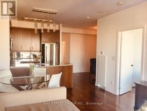 Toronto (Annex) condo for rent - A modern kitchen with a glass table and chairs.