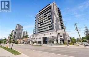 Waterloo condo for rent - A tall building with a glass facade is the focal point of the image.