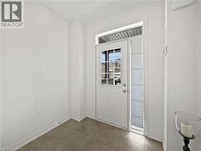 Cambridge townhouse for rent - A white door with a glass window is open to a balcony.