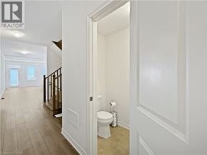 Cambridge townhouse for rent - A bathroom with a toilet and a doorway leading to another room.