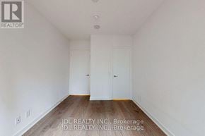 Toronto (Church-Yonge Corridor) condo for rent - A room with white walls and wooden flooring, with two doors and a ceiling light.