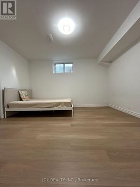 Toronto (Agincourt North) apartment for rent - A bedroom with a bed and a window.