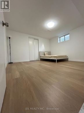 Toronto (Agincourt North) apartment for rent - A room with wooden flooring and a bed in Brokerage.