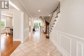 Aurora (Aurora Highlands) apartment for rent - A spacious hallway with a staircase and a dining area.