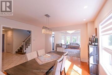 Aurora (Aurora Highlands) apartment for rent - A well-lit, spacious living room with a dining table and chairs.