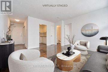 Toronto (Church-Yonge Corridor) condo for rent - A modern living room with a white chair and a coffee table.