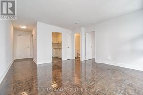 Toronto (Church-Yonge Corridor) condo for rent - A spacious room with wood flooring and white walls.
