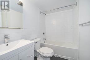 Toronto (Church-Yonge Corridor) condo for rent - A white bathroom with a toilet, sink, and bathtub.