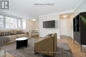 Toronto (Church-Yonge Corridor) condo for rent - A living room with a couch, chair, and television.