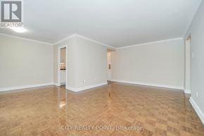 Toronto (Church-Yonge Corridor) condo for rent - Empty room with wooden flooring and white walls.