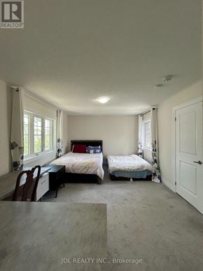 Toronto (West Hill) apartment for rent - A bedroom with two beds and a desk.