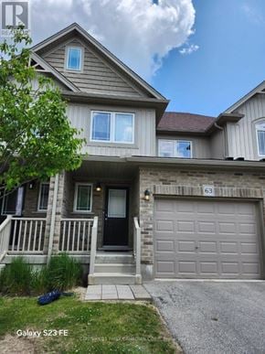London South (South B) townhouse for rent - A two-story house with a garage and a driveway.