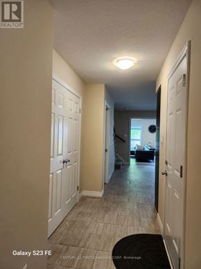 London South (South B) townhouse for rent - A hallway with a black rug and white doors.