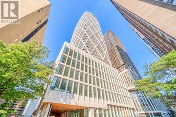 Toronto (Kensington-Chinatown) condo for rent - A tall building with the words "HOME LANDMARK" on the front.