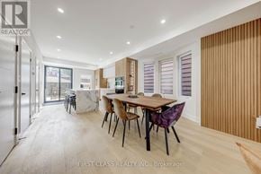 Toronto (Palmerston-Little Italy) apartment for rent - A dining room with a table and chairs is shown in the image.