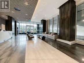 Oakville (Ro River Oaks) condo for rent - A spacious lobby with a wooden ceiling and marble floors.