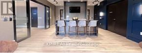 Toronto (East End-Danforth) condo for rent - A dining room with a long table set for six.