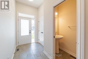 North Grenville townhouse for rent - A bathroom with a sink and a toilet in it.