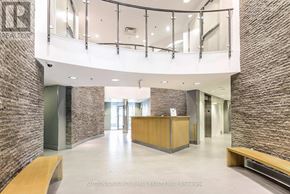 Toronto (Niagara) condo for rent - A reception area with a wooden desk and benches.