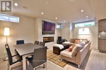 Toronto (Yonge-St. Clair) apartment for rent - A well-lit living room with a dining table and a couch.