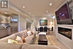 Toronto (Yonge-St. Clair) apartment for rent - A living room with a grey couch and a television.