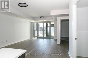 Toronto (University) condo for rent - A room with a white table and a door leading to a balcony.