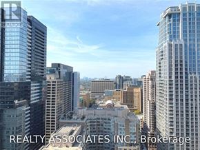 Toronto (Bay Street Corridor) condo for rent - A cityscape with skyscrapers and a clear sky.
