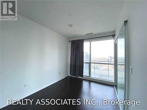 Toronto (Bay Street Corridor) condo for rent - A room with a sliding glass door leading to a balcony.