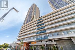 Vaughan (Brownridge) condo for rent - A tall building with a glass facade and a sign that reads "20 SUPPER MALL L WAY".