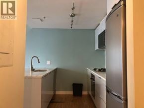 Vancouver apartment for rent - A kitchen with a sink, stove, and refrigerator.