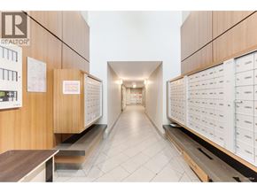 Burnaby apartment for rent - A hallway with a Realtor sign on the wall.