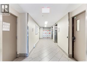 Burnaby apartment for rent - A hallway with a sign that says "REALTOR" on the top left corner.