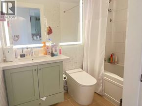 Vancouver apartment for rent - A bathroom with a toilet, sink, and bathtub.