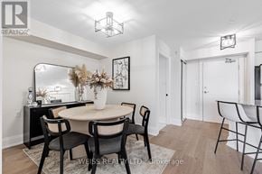 Toronto (Bathurst Manor) condo for rent - A dining room with a round table and chairs.