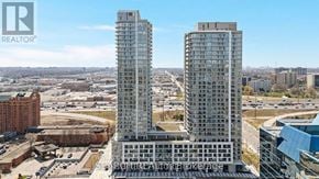 Toronto (Agincourt South-Malvern West) condo for rent - Two tall buildings are in the foreground with a cityscape in the background.