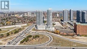 Toronto (Agincourt South-Malvern West) condo for rent - A cityscape with a highway and buildings, including a sign for RE/MAX Imperial Realty.