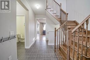 Markham (Cornell) apartment for rent - A wooden staircase leads up to a second floor landing.