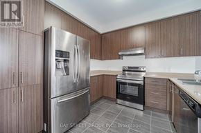 Markham (Cornell) apartment for rent - A modern kitchen with a refrigerator, oven, and sink.