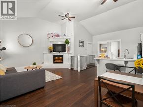 Hamilton apartment for rent - A living room with a grey couch and a fireplace.
