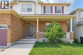 Cambridge apartment for rent - A house with a red garage door and a brick wall.
