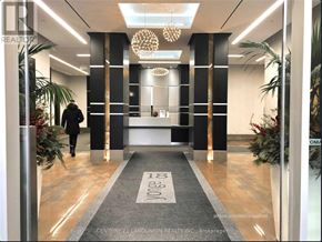 Toronto (Waterfront Communities) condo for rent - A reception area with a person walking in.