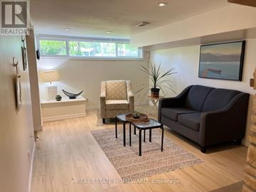 Toronto (Woburn) apartment for rent - A living room with a couch, chair, and coffee table.