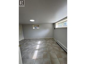 Vancouver apartment for rent - A room with tile flooring and a window.