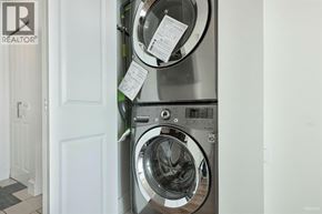 Vancouver apartment for rent - A washing machine with a white door and a black and white checkered floor.