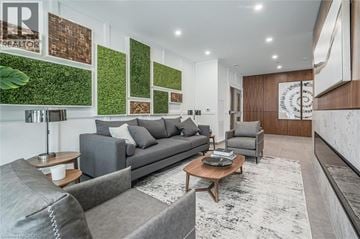 Guelph condo for rent - A living room with a grey couch and a coffee table.