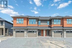 Ottawa townhouse for rent - A modern two-story house with a brick facade and multiple garage doors.