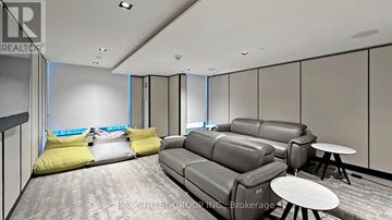 Toronto (North St. James Town) condo for rent - A living room with grey couches and yellow pillows.