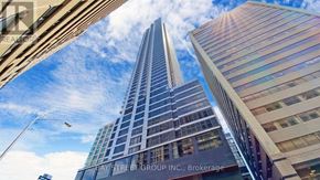 Toronto (North St. James Town) condo for rent - A tall building with the words Pay Street Group Inc. Brokerage on it.